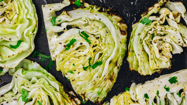 Several grilled cabbage wedges with spices