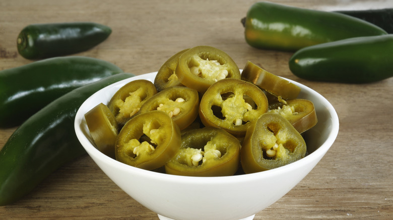 Bowl of sliced pickled jalapeños