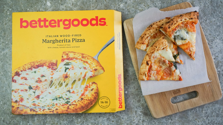bettergoods Italian Wood-Fired Margherita Pizza next to slices on cutting board