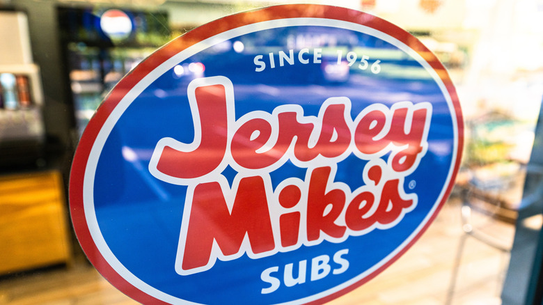 Sticker sign on a Jersey Mike's window