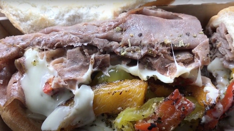 Open-faced Arby's Chicago-style beef dip sandwich with roast beef, peppers, and Swiss cheese