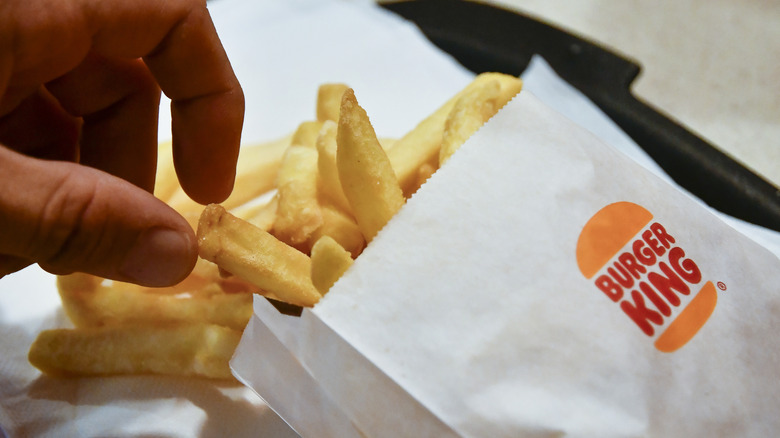 Diner reaching for tasty Burger King fries