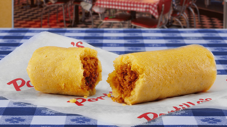 A Portillo's tamale torn in half