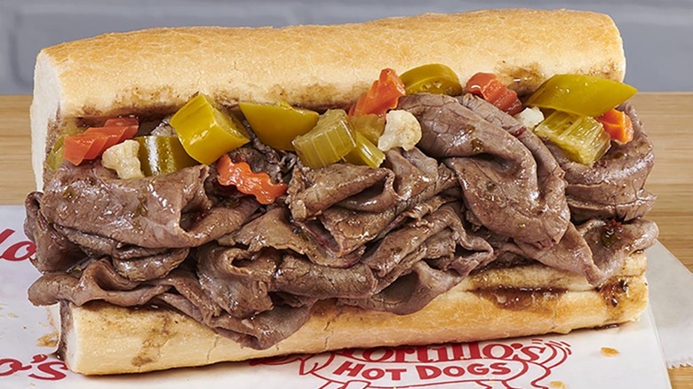 Close up of Portillo's Italian beef sandwich on bread with peppers