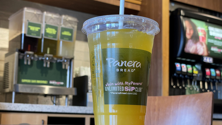 A beverage in front of a Panera drink station.