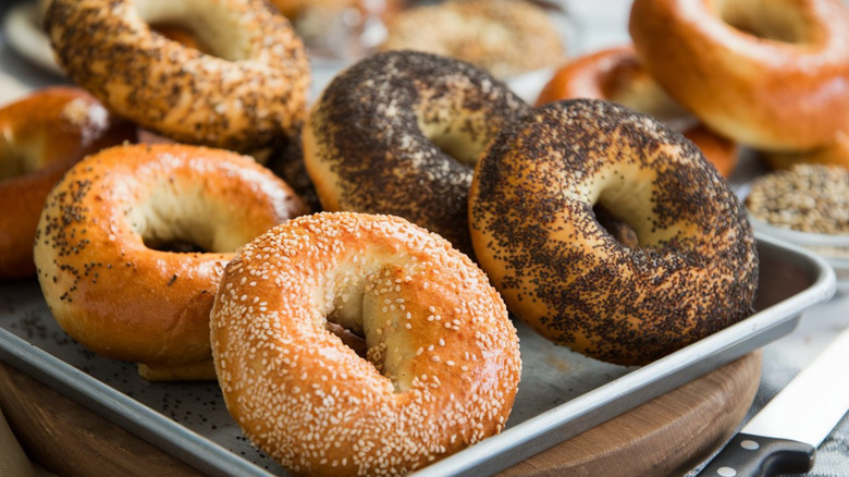 Assorted bagels on a tray.