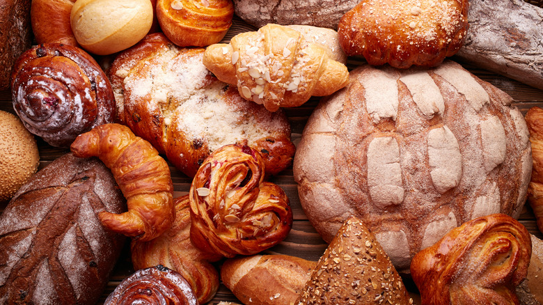 An assortment of breads and pastries piled together