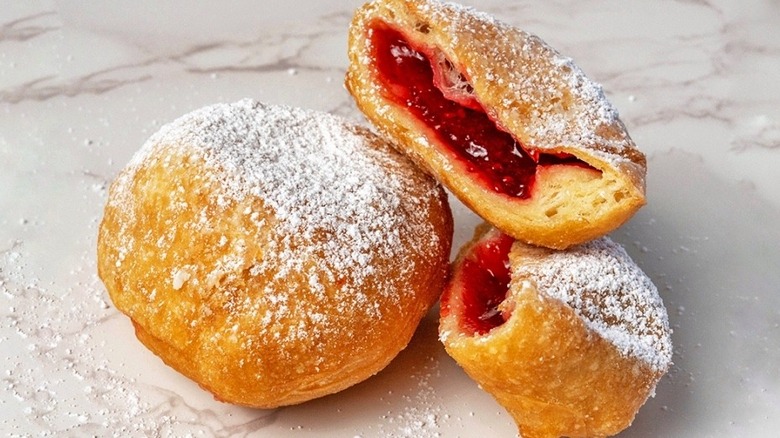 The raspberry ponchik from Papillon, cut in half to reveal the filling