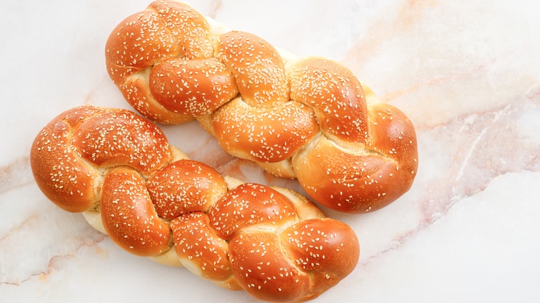 Two loaves of freshly baked challah bread