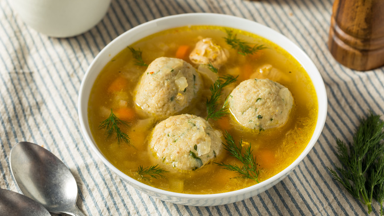 White bowl of matzo ball soup