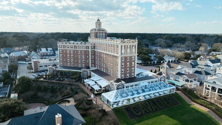 Large hotel on a grassy hill