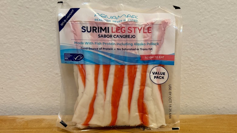 A package of Aquamar Surimi Leg Style Fresh Imitation Crab against a white wall