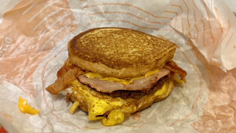 A Loaded Breakfast Sandwich from Jack in the Box sitting on its wrapper