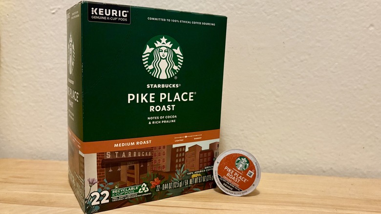 A box of Starbucks Pike Place K-Cups, next to a single coffee pod