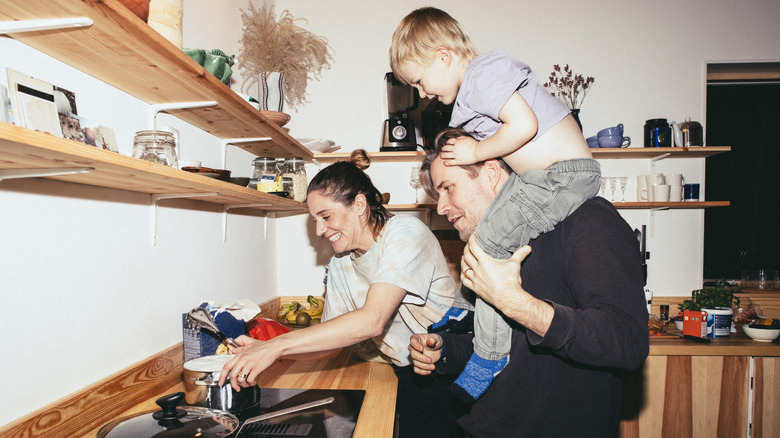 A family in a kitchen with little storage space