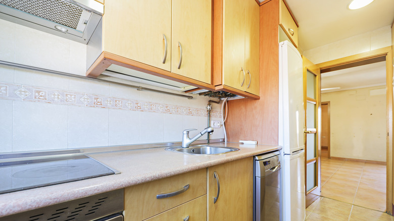 Kitchen with old and mismatched appliances