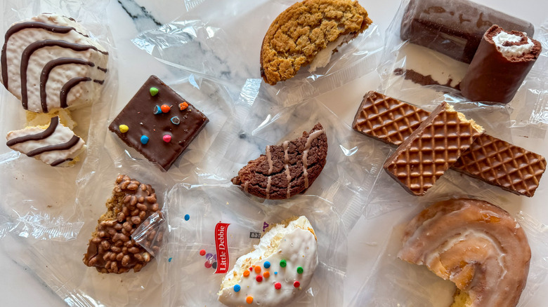 Little Debbie half-eaten snacks on marble surface