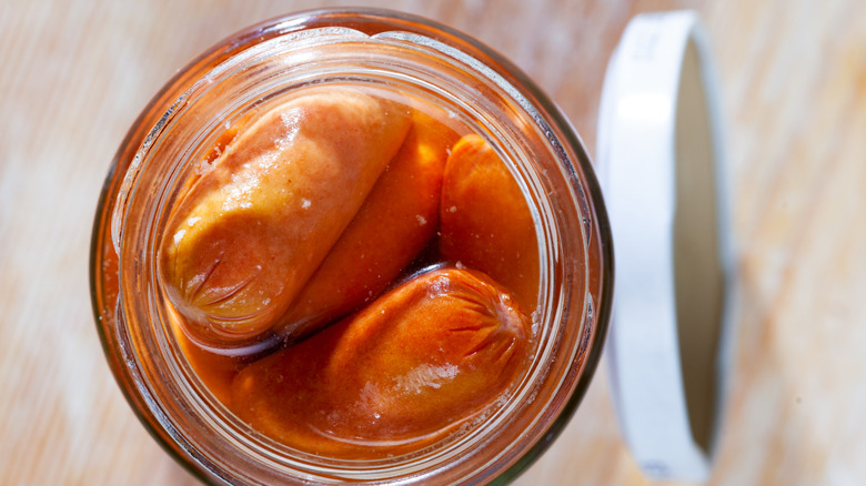 Sausages in a jar with lid