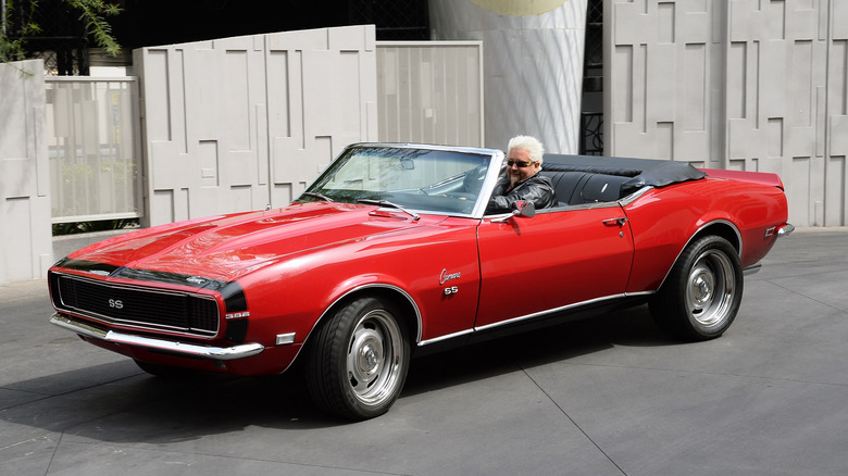 Guy Fieri in his red Camaro