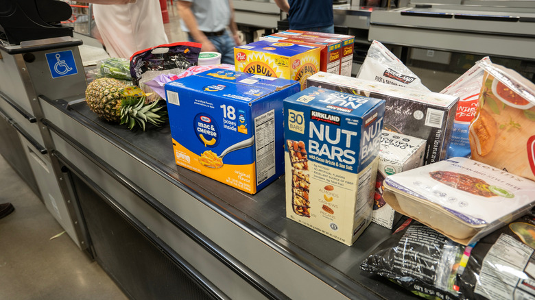 Various items on the conveyor belt at the Costco checkout
