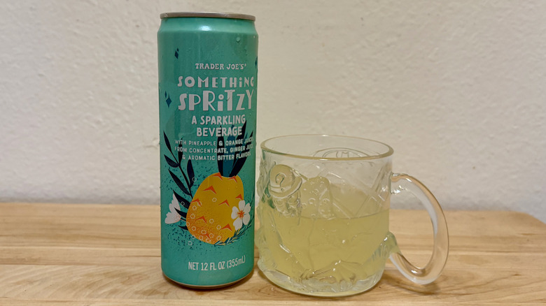 A glass of Something Spritzy next to its can.