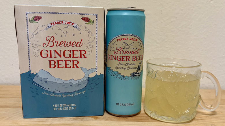 A glass of Brewed Ginger beer next to the can it came in (next to the box it came in).