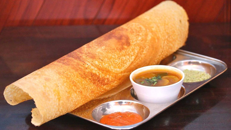 Dosa crepe with dipping sauces