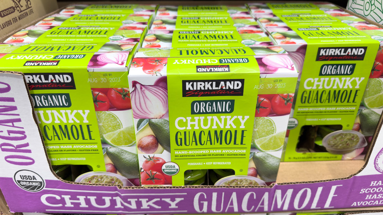 Boxes of Kirkland Signature Organic Chunky Guacamole at a Costco warehouse