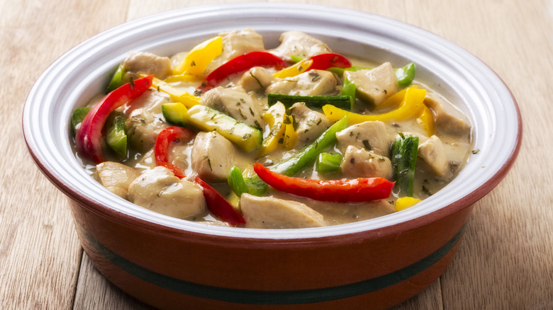 A casserole dish filled with chicken a la king