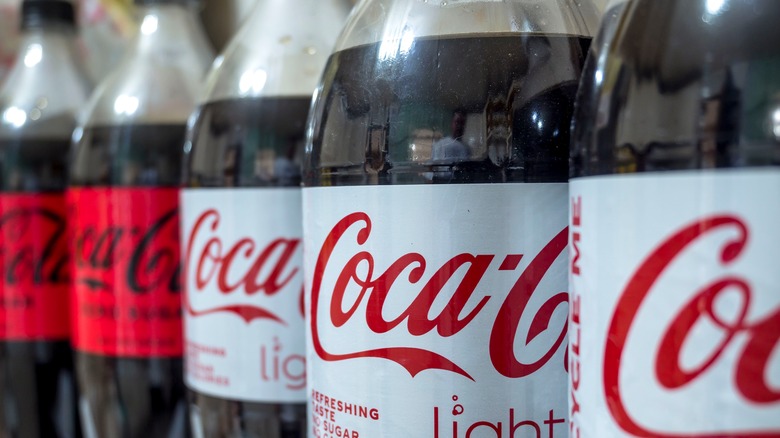 row of Coke bottles