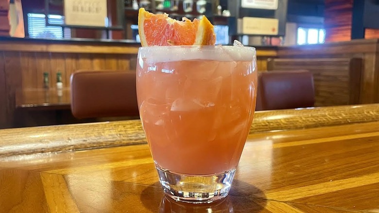 Outback Steakhouse's Castaway Cocktail on a wooden bar top
