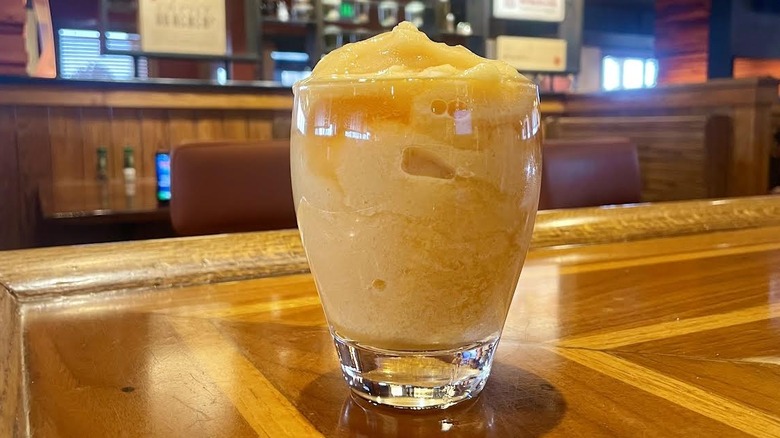 Outback Steakhouse's The Wallaby Darned cocktail on a wooden bar top