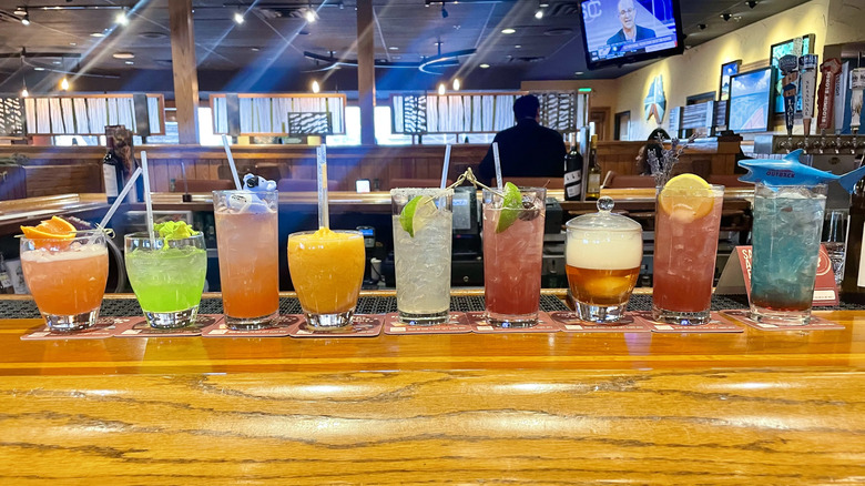 Lineup of Outback Steakhouse cocktails on a wooden bar top