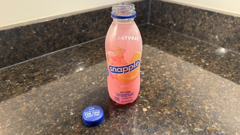 Pink lemonade in a bottle on a counter