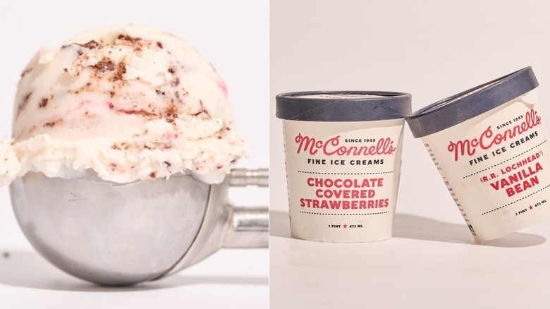 Two pints of McConnell's balanced on a table, one vanilla bean flavor, the other chocolate covered strawberries, and a scoop of strawberry chocolate ice cream
