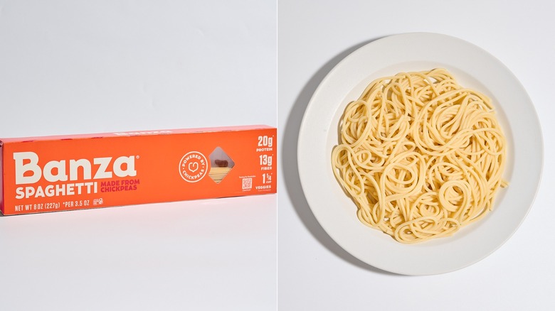 Banza pasta box on a table next to a plate of cooke pasta.