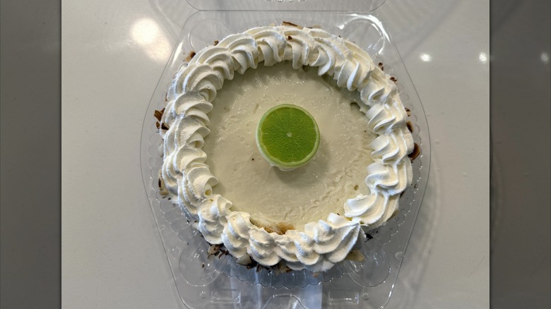 Publix mini key lime pie in clear plastic container on a white table