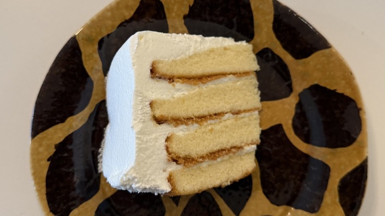 Vanilla buttercream cake slice from Publix on a giraffe-print plate