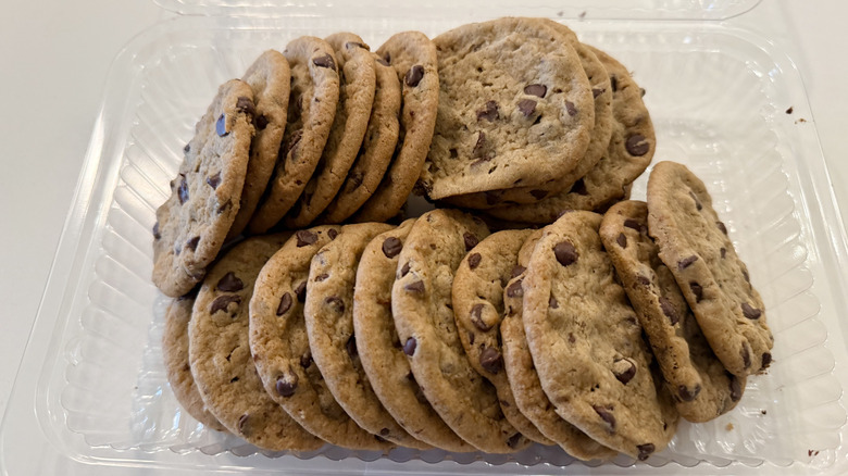 Container of Publix chocolate chip cookies on a white table