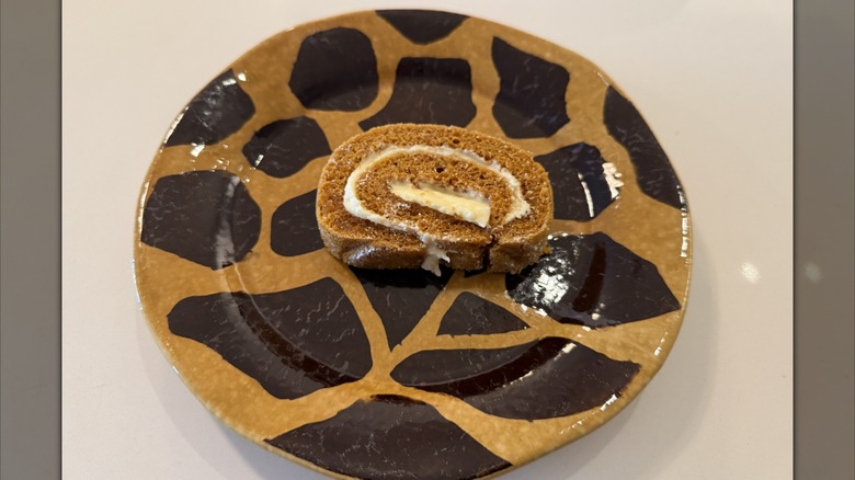 Pumpkin roll slice on a giraffe-print plate