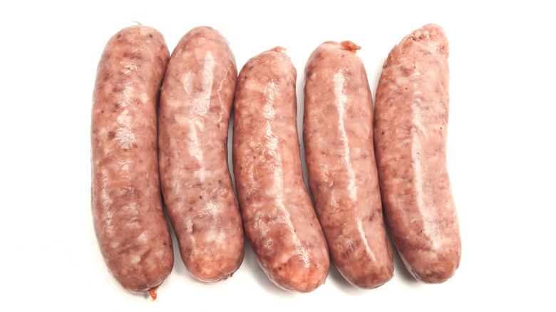 raw sausages lined up