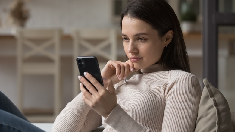 woman looking at phone