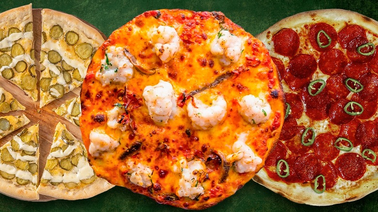 assortment of three different kinds of pizza