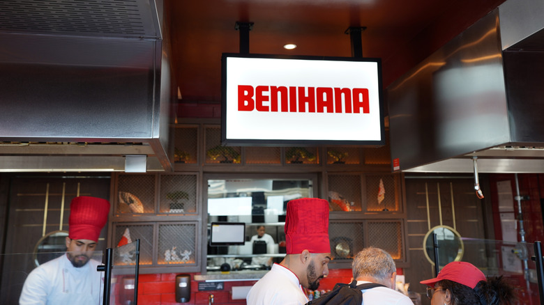 Benihana sign hanging over chefs in restaurant