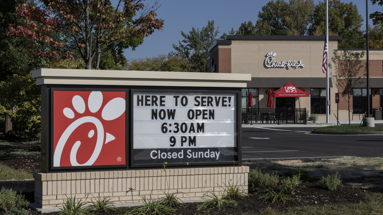 sign in front of a Chick-fil-A restaurant