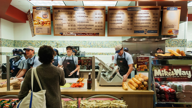 workers at Jersey Mike's help customers