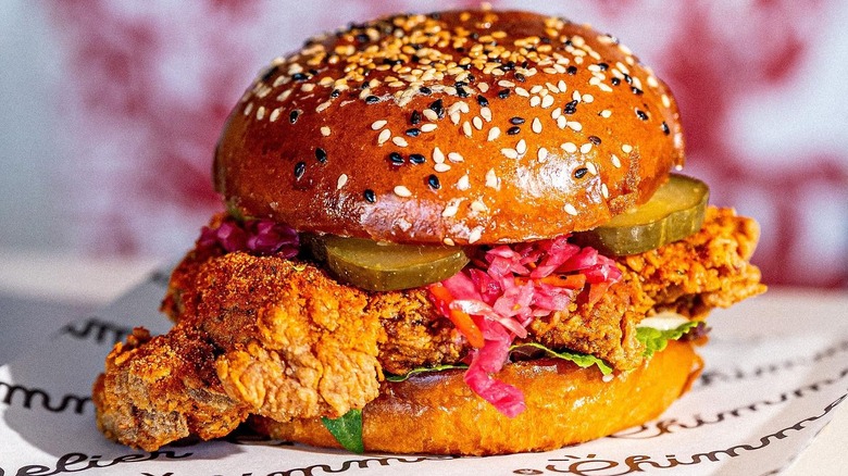 A K-Chicken Burger from Chimmelier with pickles and coleslaw