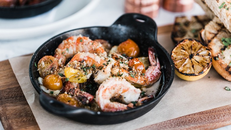 A cast iron skillet of shrimp scampi at North Italia