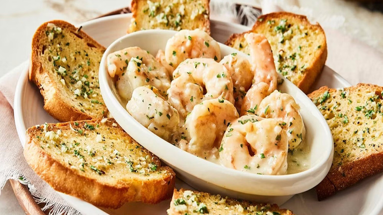 A plate of shrimp scampi with garlic toast at Carraba's Italian Grill