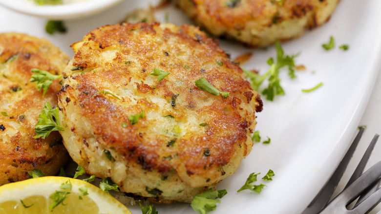 A close-up of crab cakes on a plate